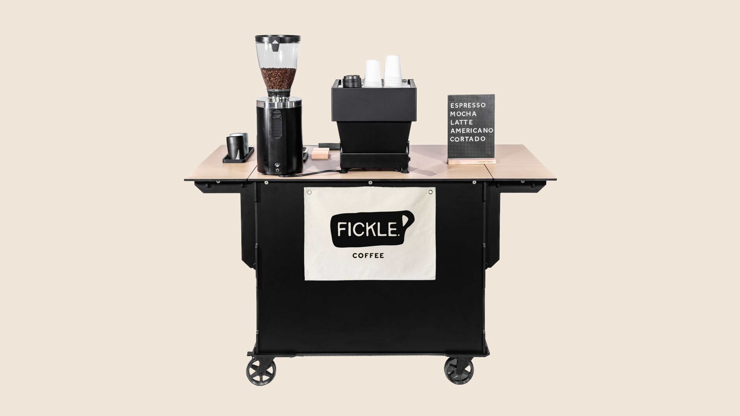 Mobile coffee cart branded with the Fickle. Coffee logo and espresso equipment