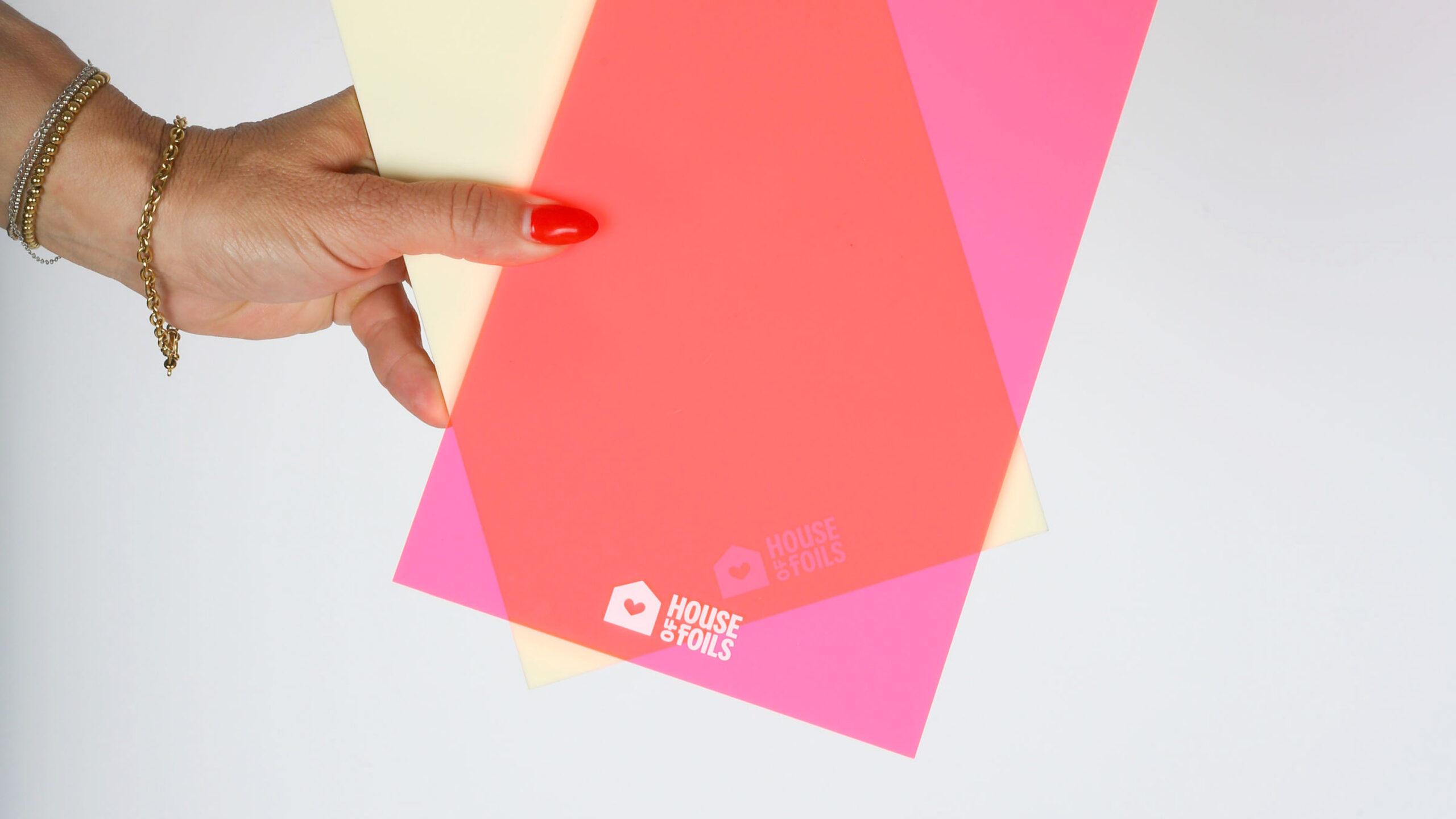 House of Foils branded merchandise including hats and printed materials