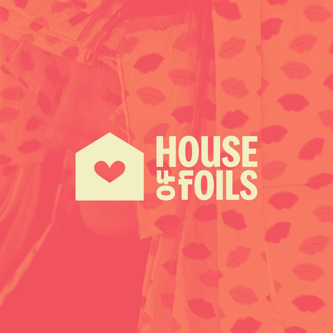 Yellow logo on pink textured background photo.