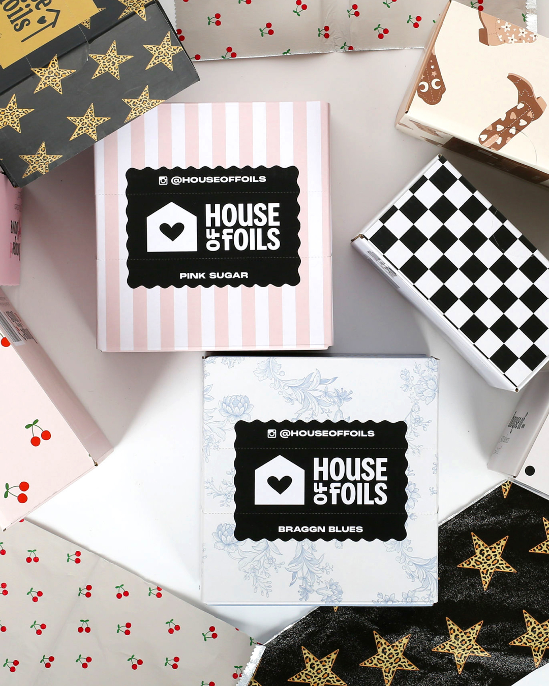 A variety of boxes laid out featuring House of Foil's varied patterns.